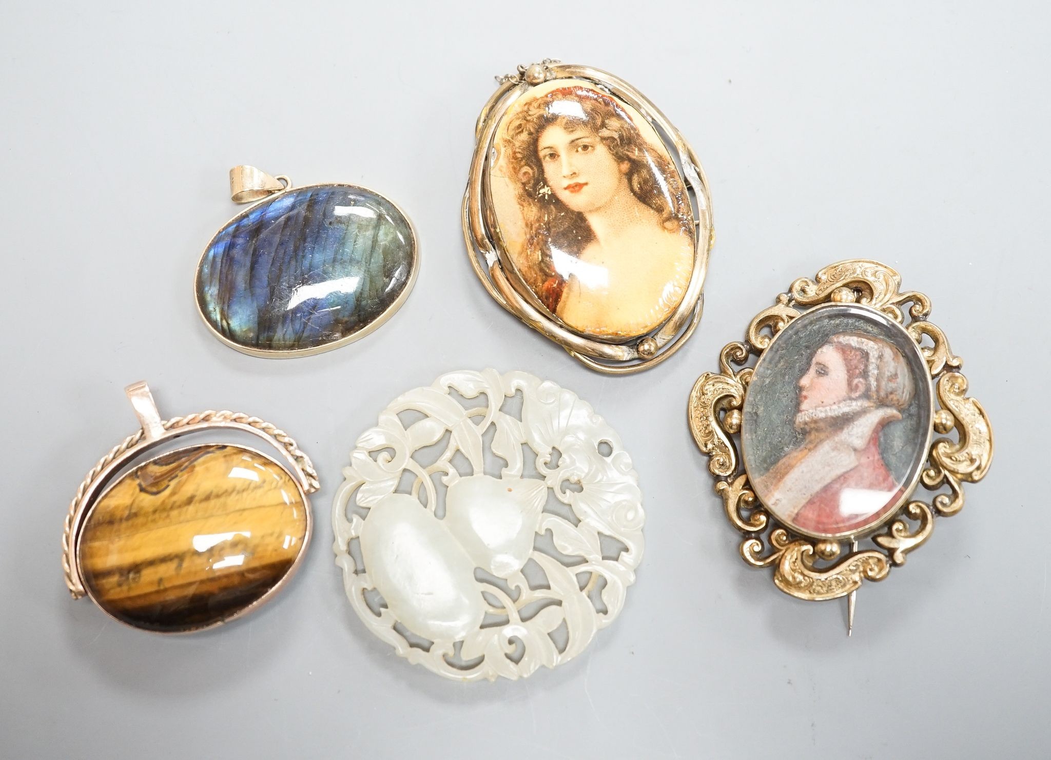 A 19th century gilt metal mounted brooch, with inset oval painted wax bust of a lady to dexter, 60mm and four other items including a 9ct mounted oval tiger's eye quartz pendant.